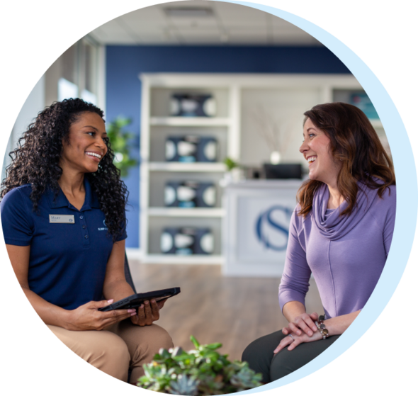 Outfitter and guest in store