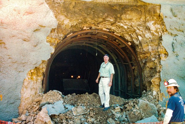  An old image of a man standing in the entrance to what will be the wine caves, but is under construction.