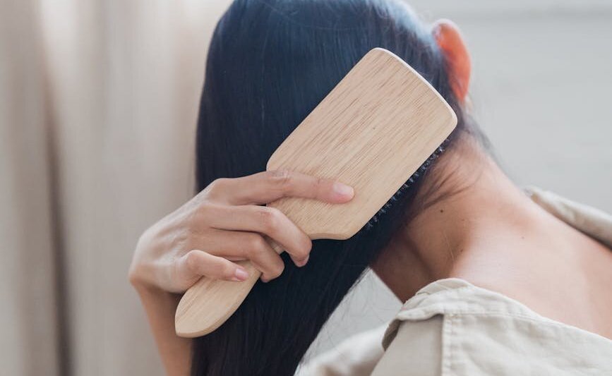 Someone brushing their hair.