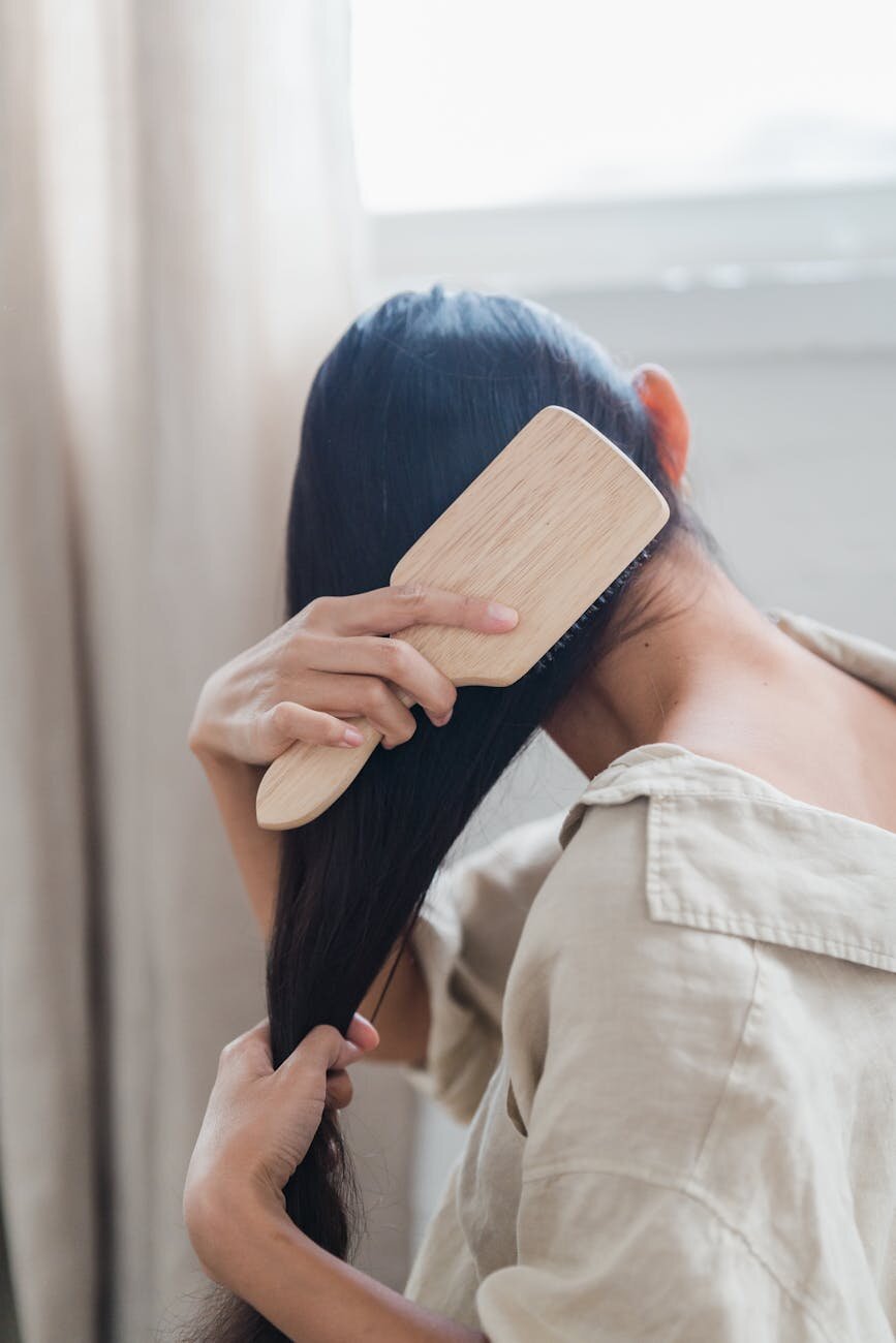 Someone brushing their hair.