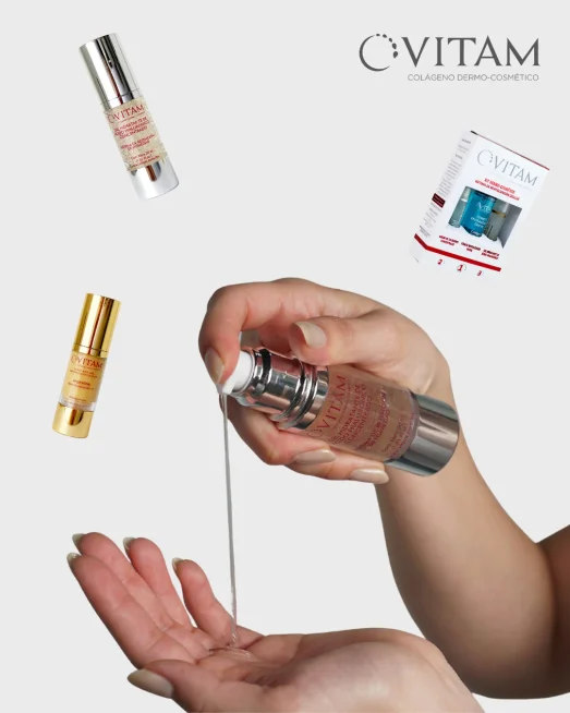 Mano aplicando gel hidratante de ácido hialurónico concentrado Vitam junto a sueros antiedad y kit de skincare dermo-cosmético.