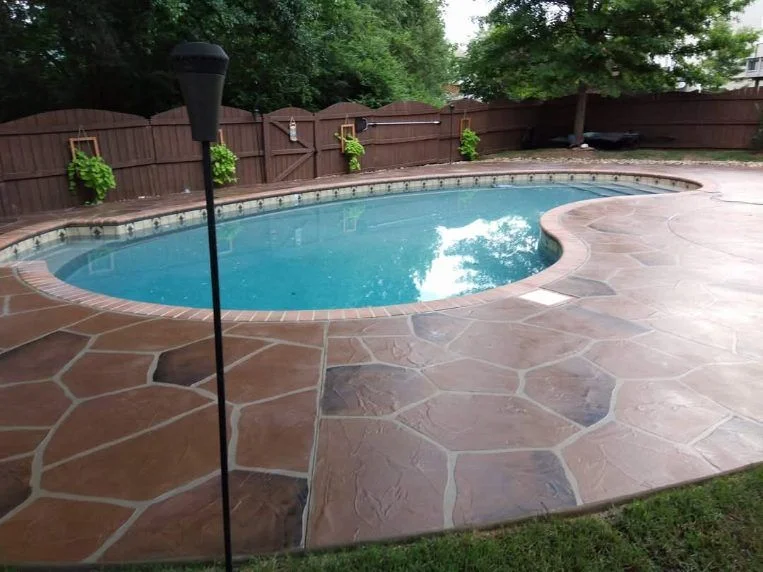 Terracotta flagstone-pattern concrete pool deck