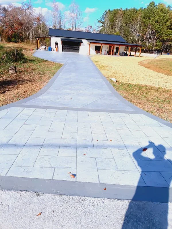 Stamped concrete driveway with a geometric border pattern