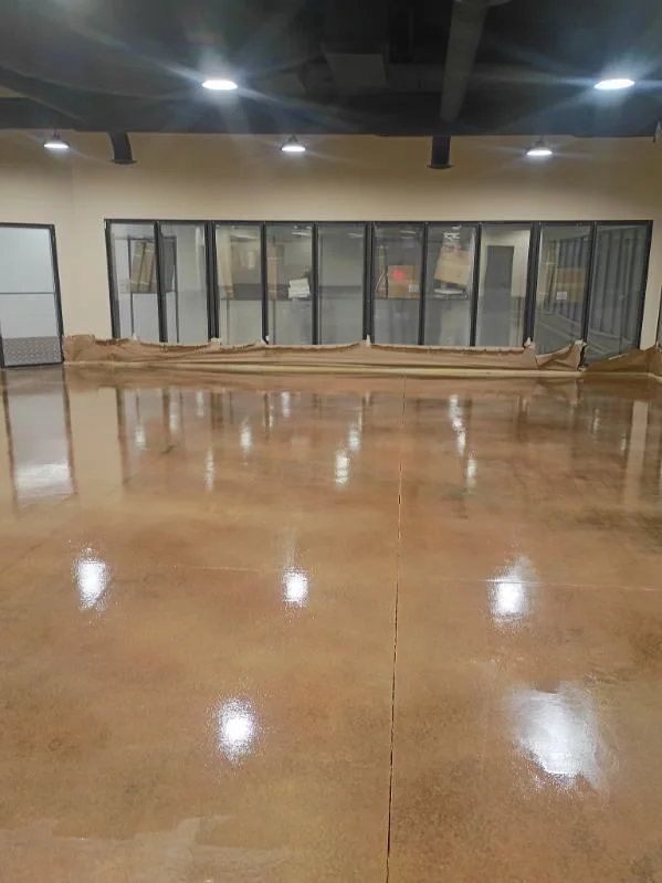 Glossy stained concrete floor in a commercial interior