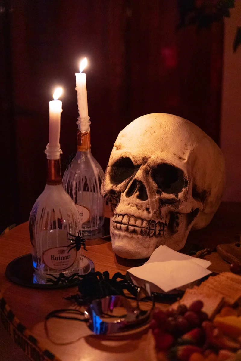 Halloween table styling with candles and skull decor