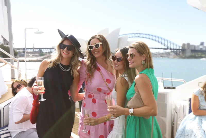 Guests celebrating Melbourne Cup on Sydney Harbour deck