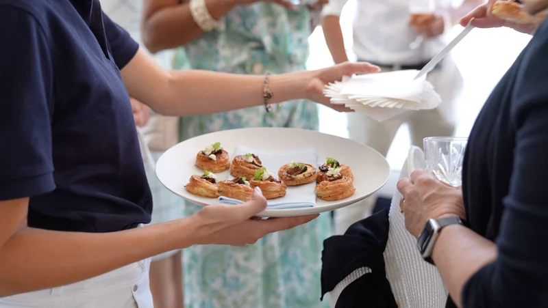 Canapés being served during Melbourne Cup yacht charter