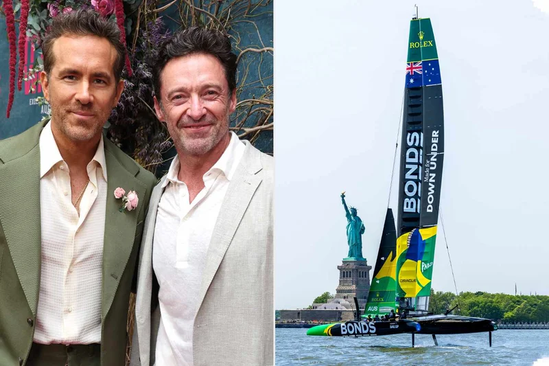Hugh Jackman and Ryan Reynolds with Team Australia SailGP yacht