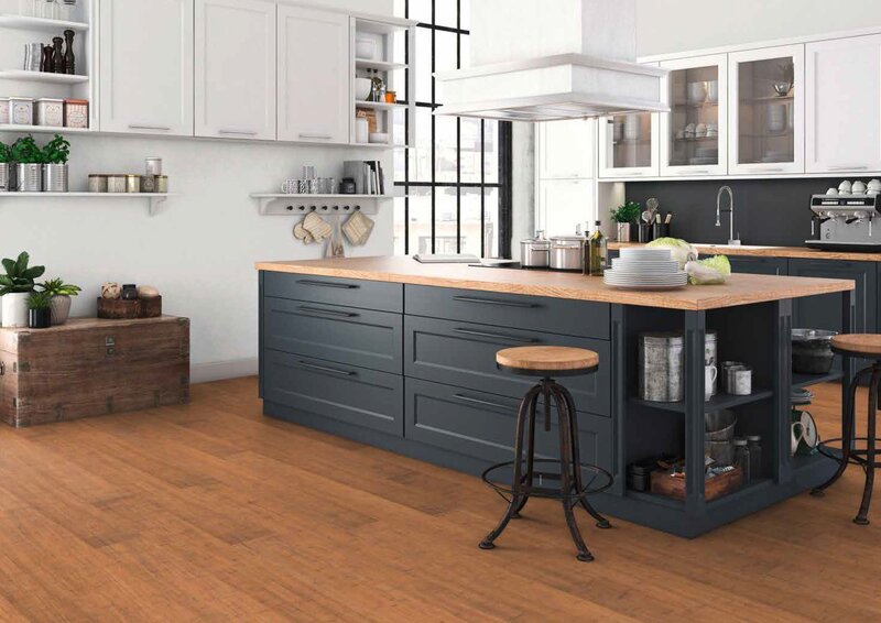 MOSO bamboo flooring installed in a contemporary kitchen with dark navy cabinetry and wooden island worktop