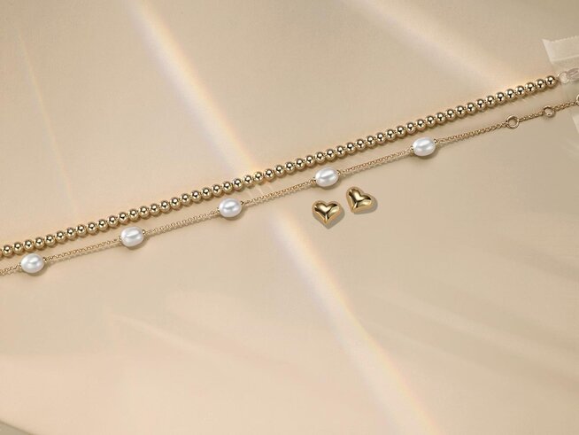 Birthstone necklaces laid out on a surface