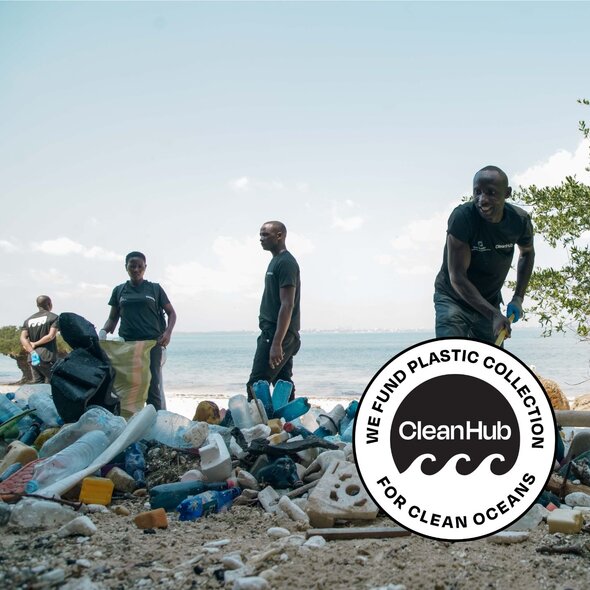 Image of the team working on the beach to clear plastic pollution that has been dumped or washed up. 