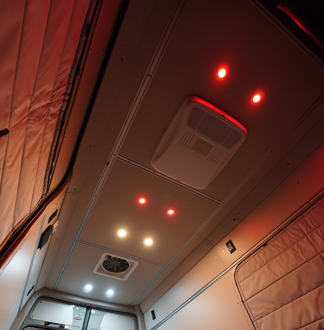 The Dometic Penguin II internal distribution box is integrated into the camper van ceiling. The air controls and vents are highlighted.