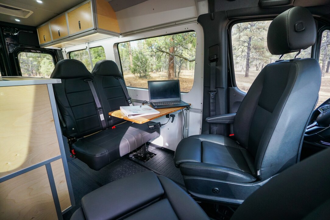 There is an entire mobile office set up. Utilizing the lagoon table, the Fenton chair, and the factory swivel seats. A spacious comfortable space is created.