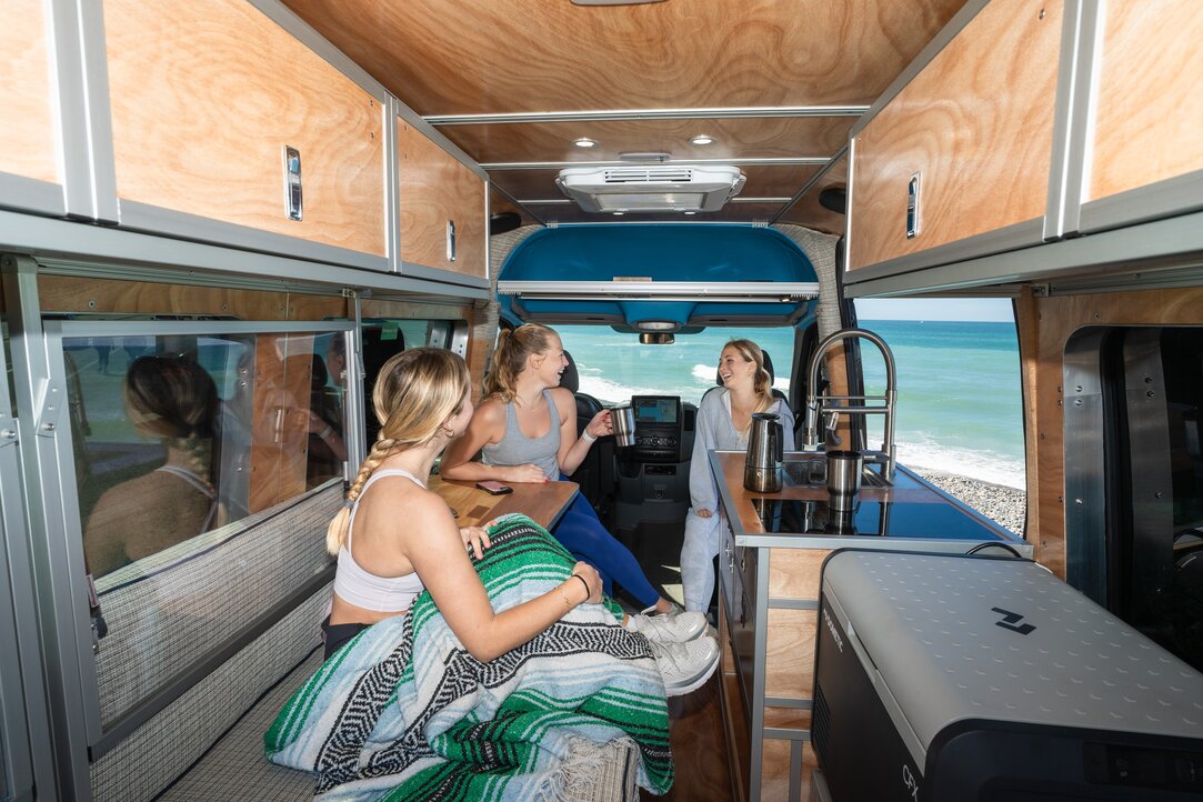 Experience the joy of spending time inside our spacious camper van with friends. Create unforgettable memories in a comfortable and inviting environment.