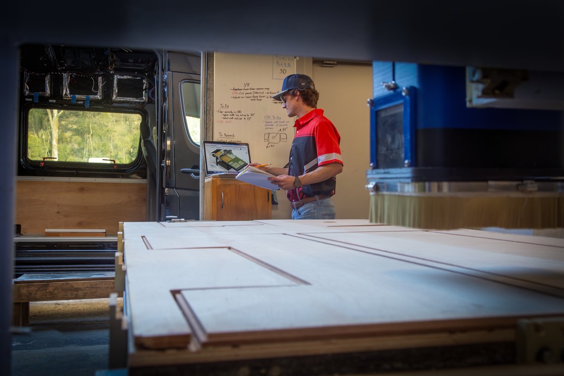 Van upfitter engineering file paths and cutting out pre-cut wooden panel kit for a DIY camper van conversion kit