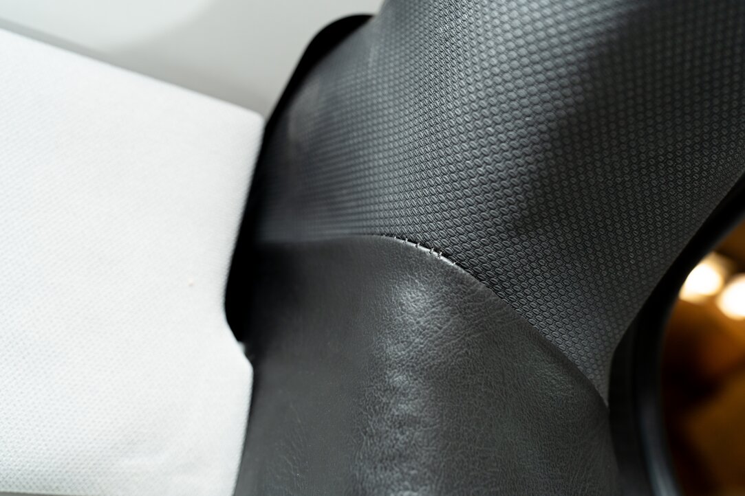 close-upclose up demonstrating attention to detail and the color pallet of this build is pictured. The pillars (d-pillars) are upholstered in black auto vinyl and the walls are done in a gray studio gray laminate.