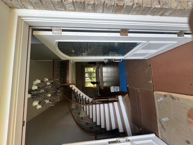 Front entry and staircase prepared for a residential move