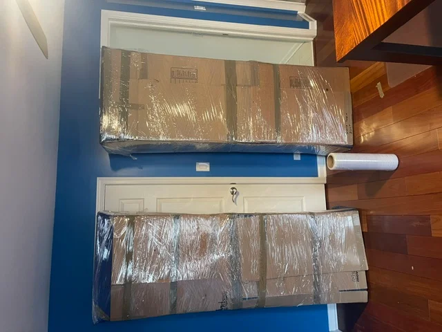 Wrapped furniture staged for loading