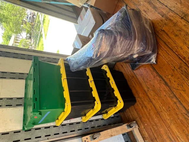 Moving equipment and wrapped furniture loaded into a truck