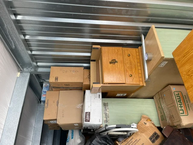 Storage unit packed with boxes and furniture