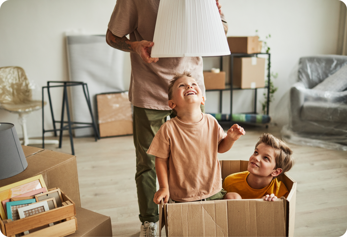 Two children playing in a box.