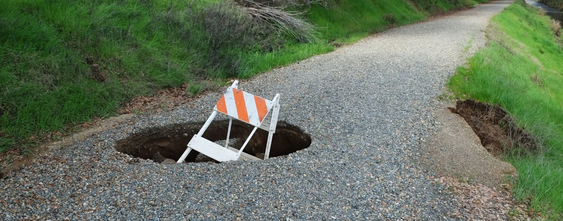 a sinkhole in a middle of a road