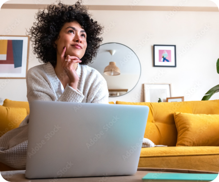 A person working at a desk with a laptop.