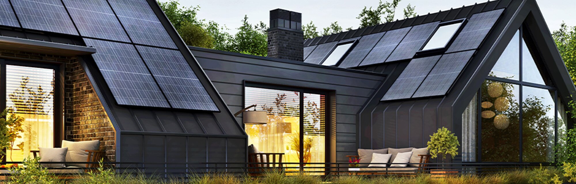 A modern, disaster-resilient home features prominent solar panels integrated into its dark metal roof. Large windows and a brick facade are also visible.