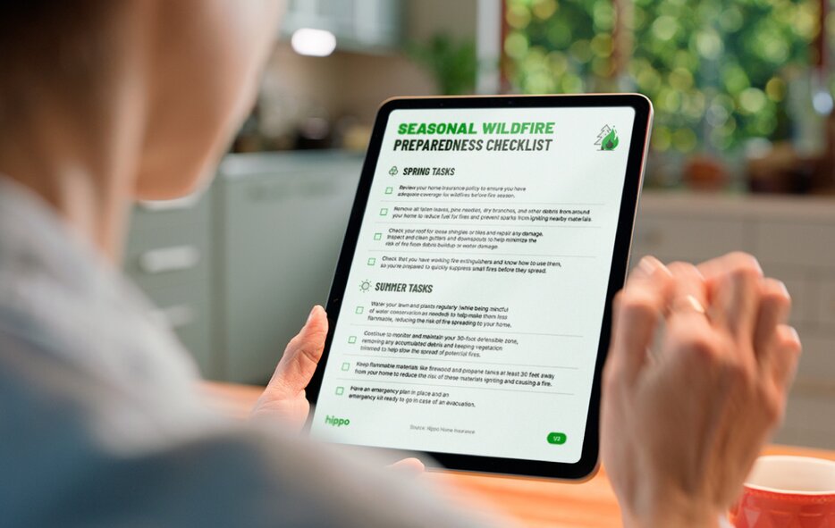 A homeowner reviews the fireproofing solutions checklist on a tablet