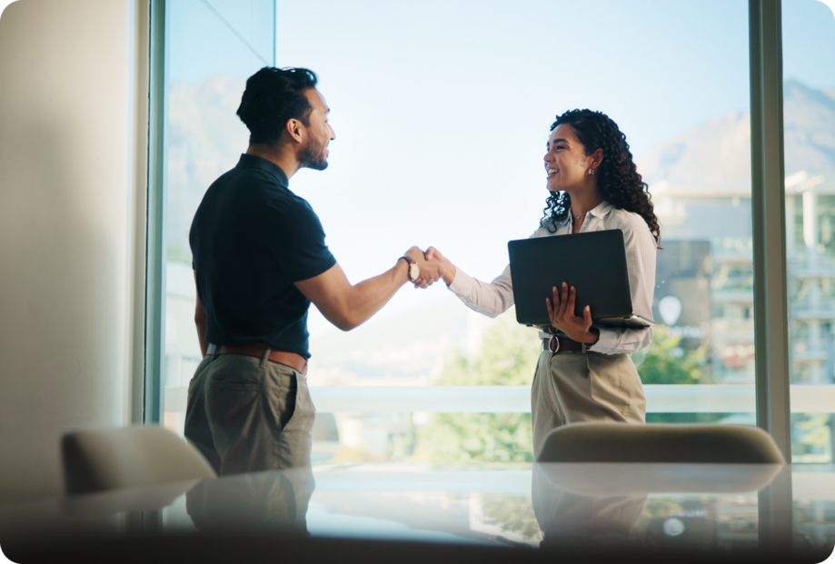 A woman and a man speaking with a man in a business suit.