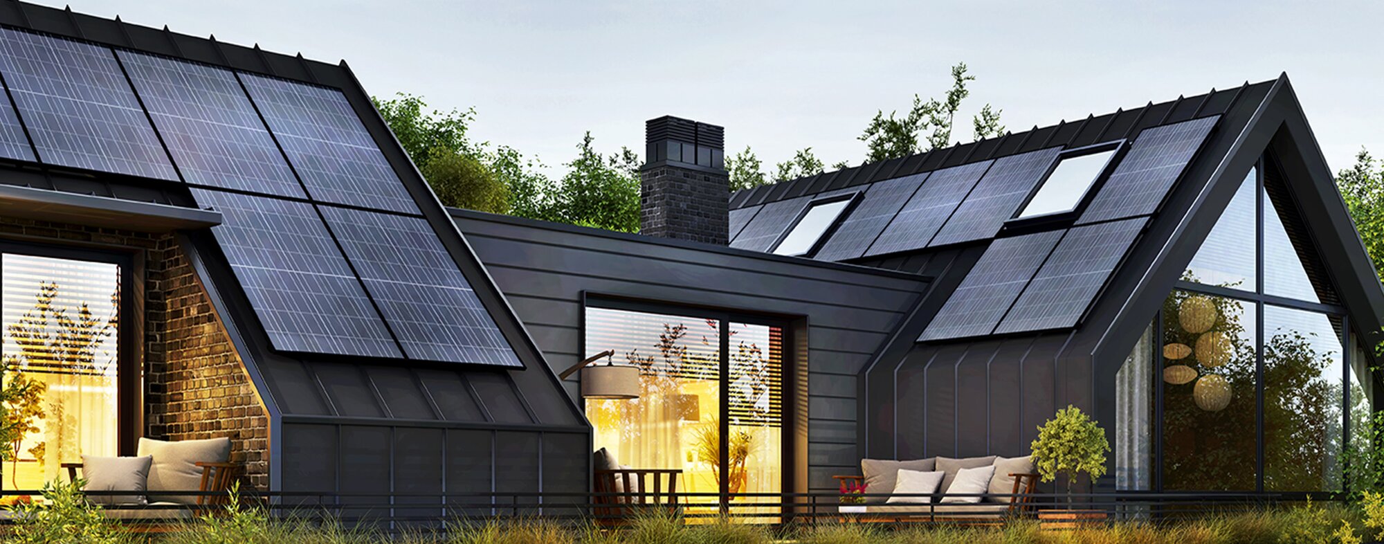 A modern, disaster-resilient home features prominent solar panels integrated into its dark metal roof. Large windows and a brick facade are also visible.