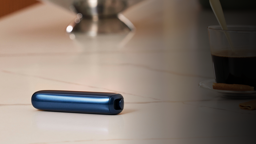 Ploom-AURA-navy-blue-on-table