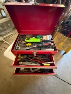 Open tool chest with hand tools
