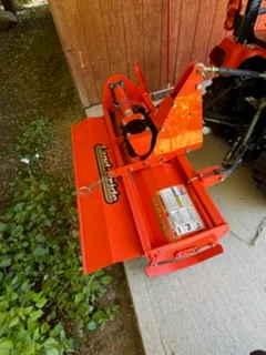Orange farm equipment attachment