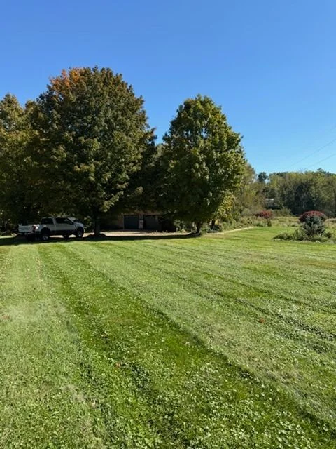 Aerial view of the auction property's open lawn