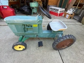 Vintage green pedal tractor