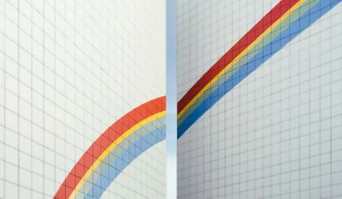 Rainbow split across two notebook pages