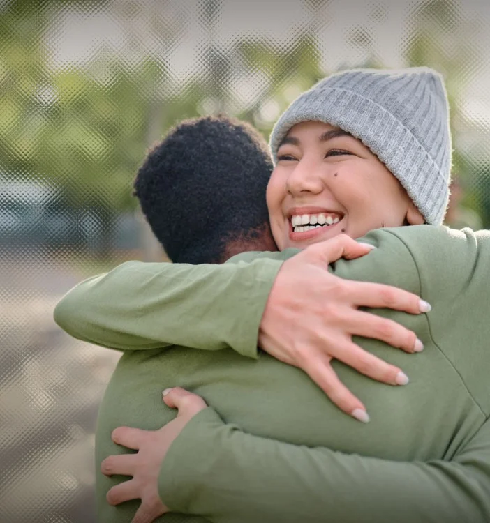 Two people hugging