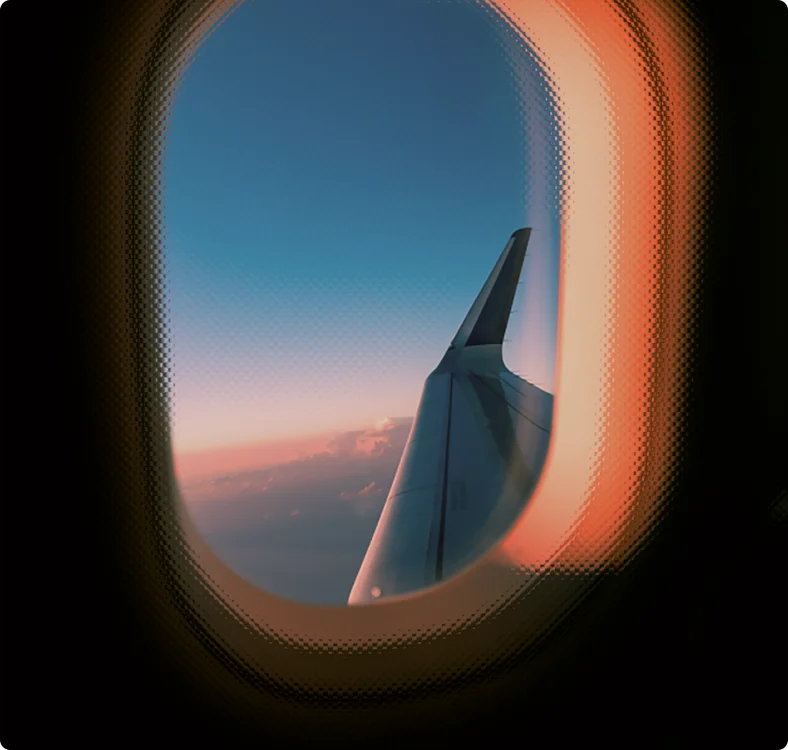 Wing of a plane, through plane's window