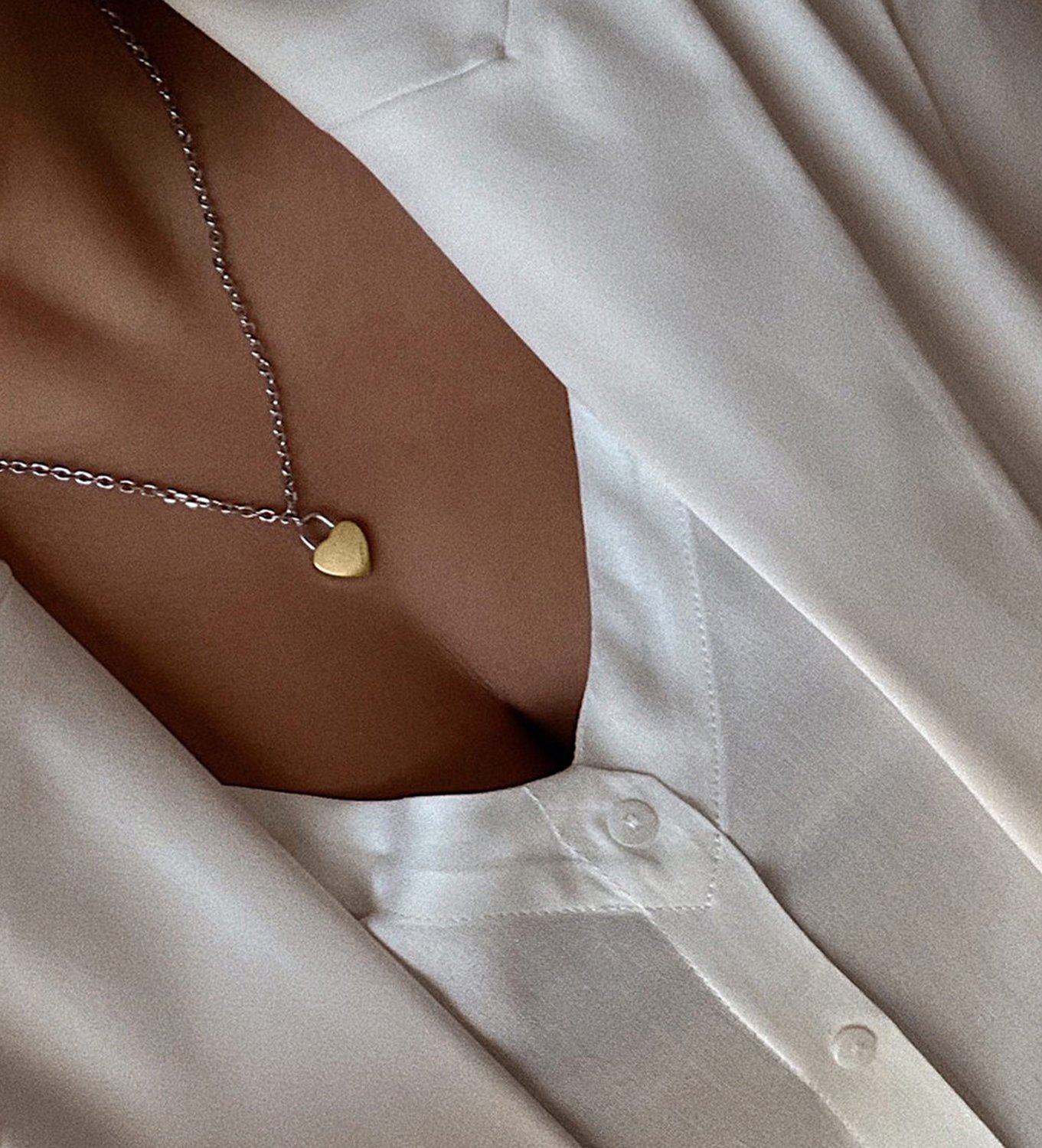 Women's MVMT heartlock necklace on model