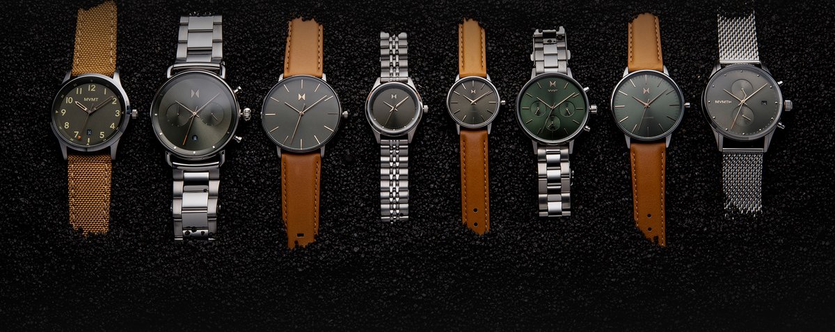 brown, green, leather, stainless steel watch on gravel background