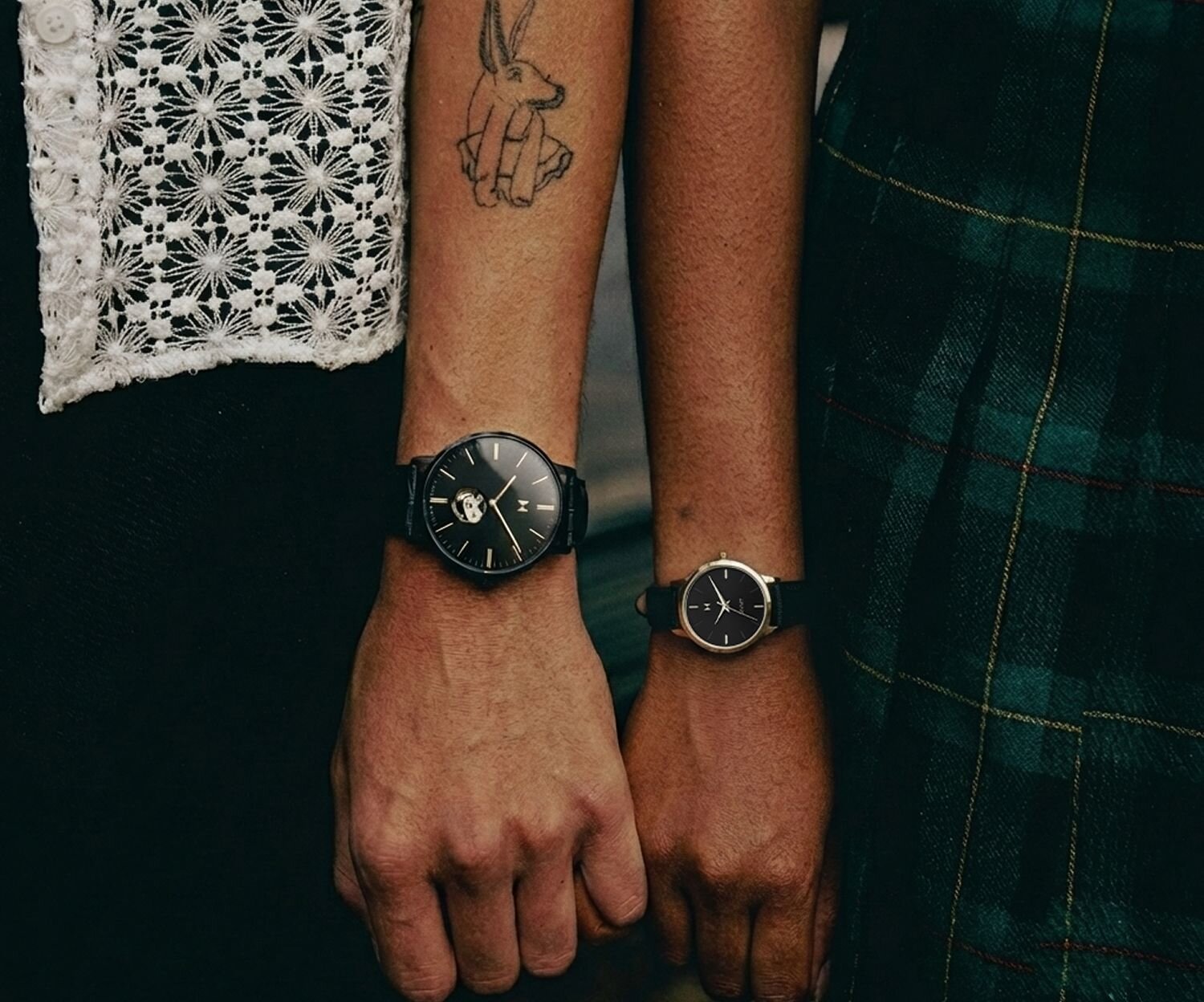 MVMT 3 watches - black watch watch underwater, white watch on wrist, black watch on hiker