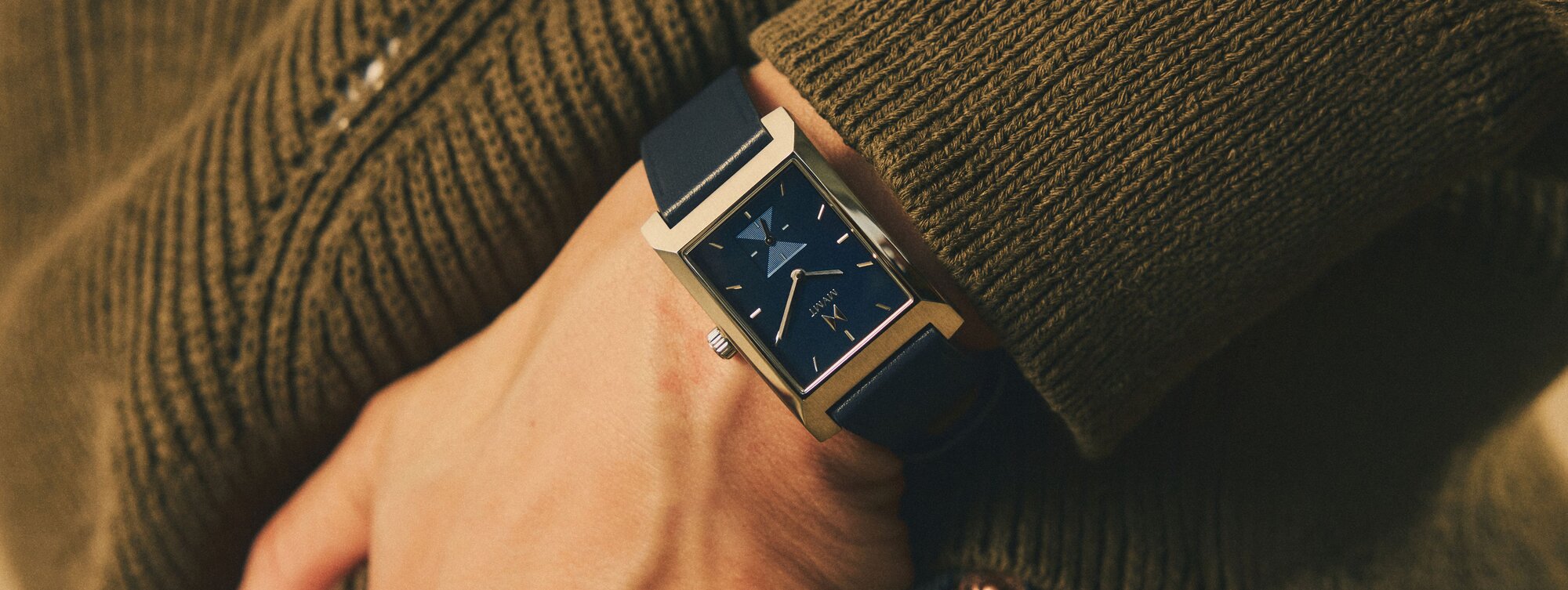 MVMT 3 watches - black watch watch underwater, white watch on wrist, black watch on hiker