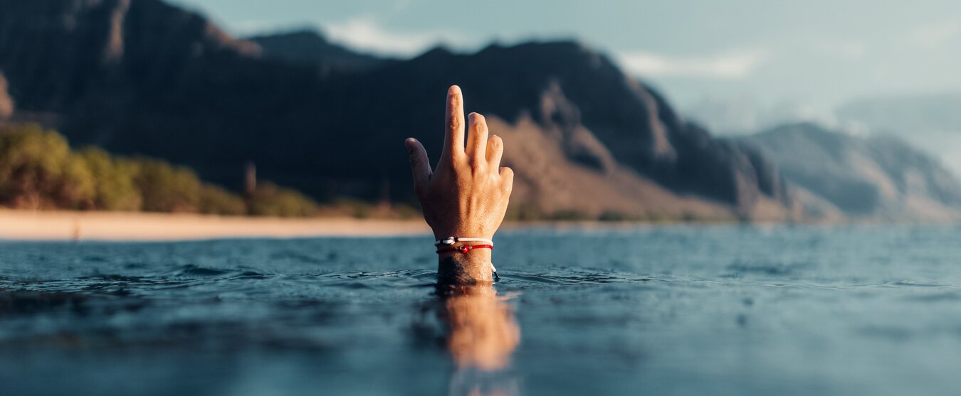 Hand coming out of water