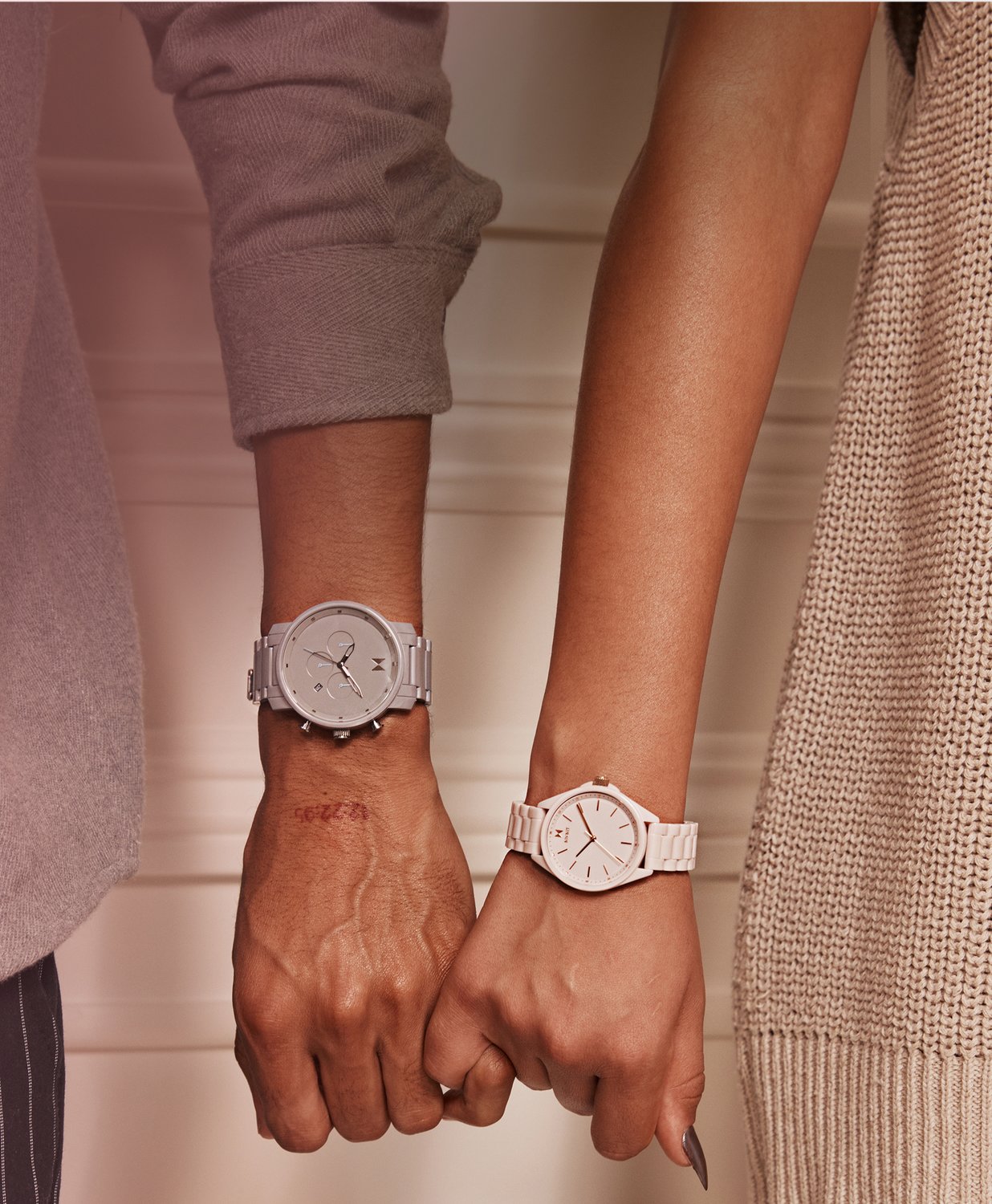 MVMT ceramic watches on man and woman's wrists