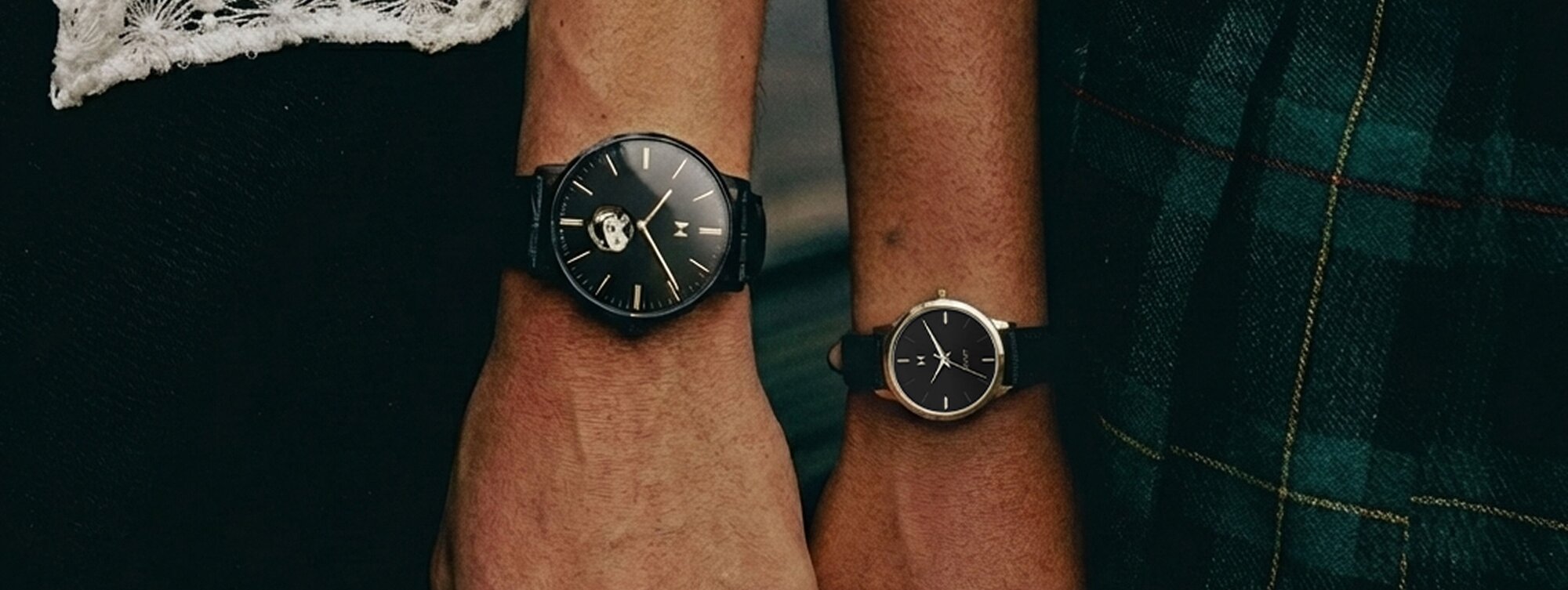 MVMT 3 watches - black watch watch underwater, white watch on wrist, black watch on hiker