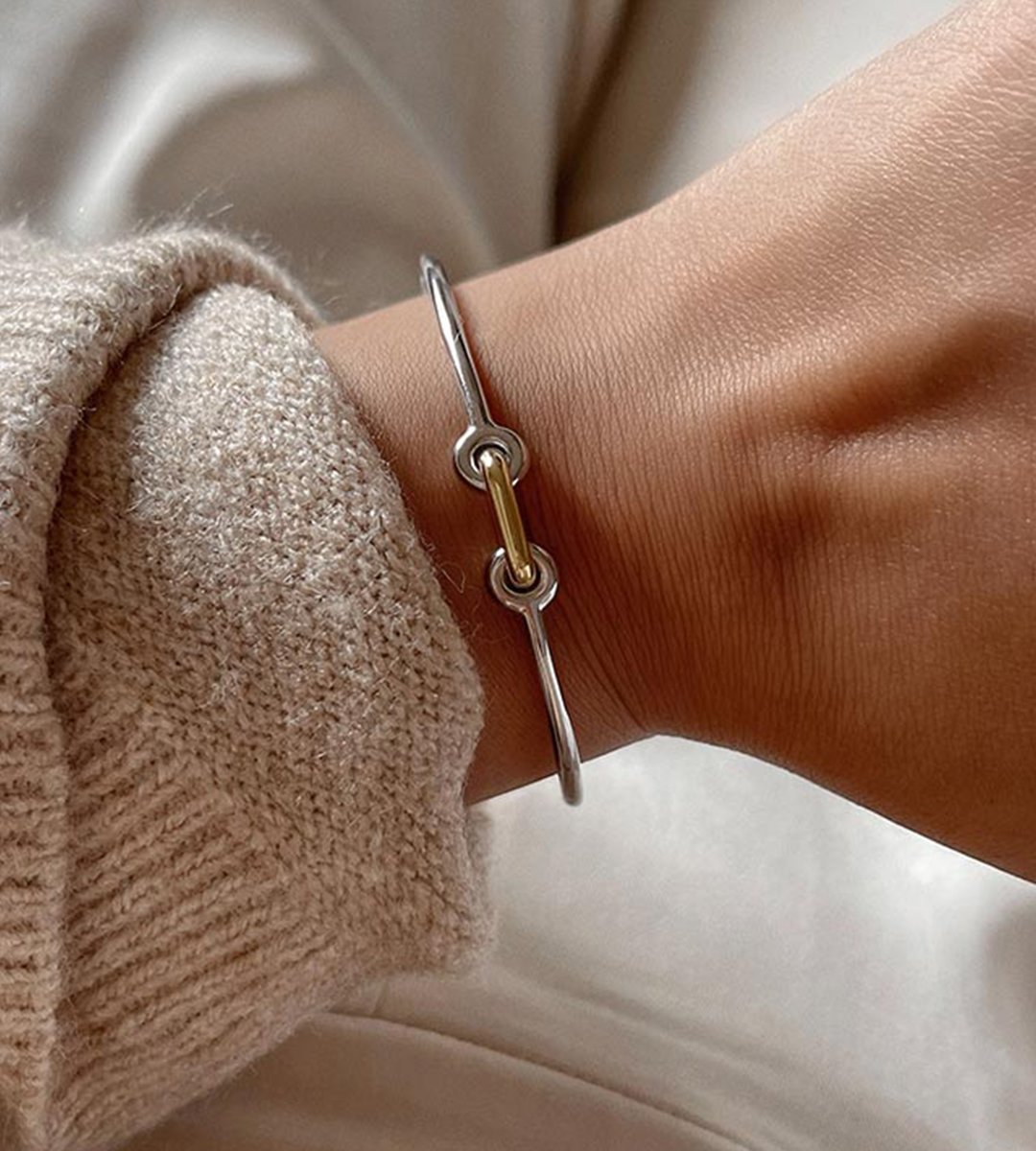 womens silver and gold unity braclete