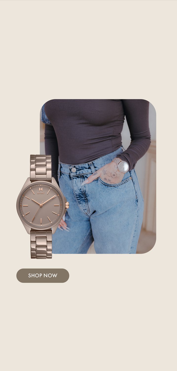 Maeve in grey top and blue jeans wearing MVMT cashmere taupe ceramic watch