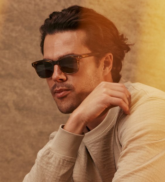 Male model wearing MVMT sunglasses