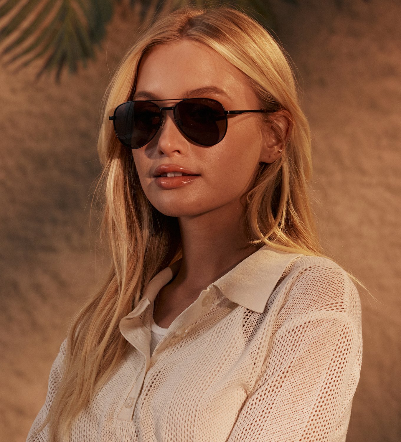 Model wearing MVMT sunglasses